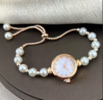 Elegant women's quartz watch with small Roman numeral dial and pearl bracelet strap, stylish wristwatch for ladies