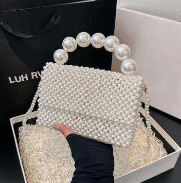 Elegant women’s pearl shoulder bag with woven design and square shape, stylish spring summer fashion accessory.